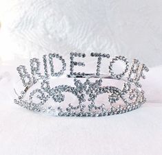 "Beautiful Bride to Be tiara for your engagement shower, bachelorette party or Girl's Night Out! Bachelorette Party Headband | Bride to Be tiara | Crown for Bachelorette This bride to be tiara is the height of glamour and celebration.  It's a keepsake every bride will wear and treasure. Pretty, sparkly, for the \"bride to be\". Perfect for the Bachelorette party This is the perfect accessory for that special bride who wants a little extra bling.  the headband is metal with rhinestone accents it is attached to a clear hair combs for easy placement.  The tiara is non-returnable. BPP is not responsible for rhinestones that come loose after shipping. -- OTHER INFORMATION -- Orders take 1-3 working days to produce. There are no returns on custom Items. ** Please make sure your shipping address Adjustable Princess Crown For Wedding, Adjustable Silver Bridal Accessories For Bridal Shower, Wedding Crown With Structured Princess Style, Adjustable Wedding Crown, Princess Style Wedding Crown With Structured Shape, Princess Style Wedding Crown With Structured Design, Princess Style Structured Crown For Wedding, Princess Style Wedding Crown, White Wedding Crown With Pinched Shape