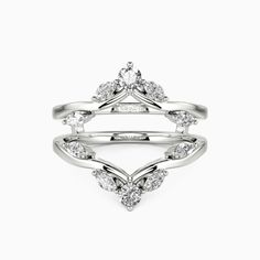 a white gold ring with three diamonds on it