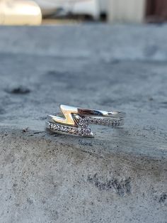 This ring set is the perfect Western accessory to add a bit of sparkle and shine to your outfit! This set features two classic sterling silver rings with a zany twist- a zig-zag design that interlocks when you stack multiple. One ring is plain sterling silver, and the other ring features beautiful set stones on the zig-zag detail and is available with CZ, moissanite, or lab diamonds. They are beautiful stacked together or on their own- this would be an adorable friendship ring set! A little unde Cowgirl Ring, Western Ring, Zara Set, Western Rings, Friendship Ring, Western Accessories, Sterling Silver Stacking Rings, Friendship Rings, Silver Stacking Rings