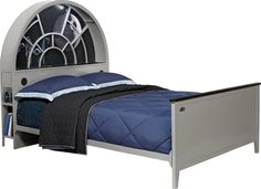 a bed with a metal headboard and foot board