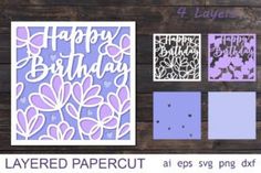 layered papercuts are displayed on a wooden surface with the words happy birthday and flowers