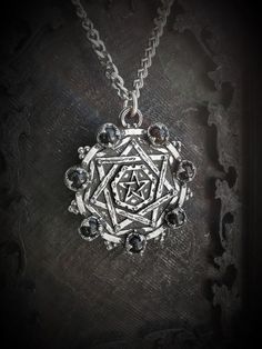 This Sigillum Dei necklace is an handmade pewter sculpture with an antique finish. This Sigillum Dei necklace is a pendant of 3.5cm and is sold with a 24'' stainless steel chain, if you would like a different chain lenght, you can ask for in in the comments when ordering :)This gothic pentagram is a pewter sculpture of my own creation, i create and work the metal by myself at home. The material used is the finest and highest grade hypoallergenic pewter alloy of 98%tinYou can combine many of my c Gothic Pewter Jewelry In Silver, Gothic Silver Pewter Jewelry, Nickel Free Gothic Pewter Jewelry, Antique Silver Hand Cast Pewter Jewelry, Gothic Silver Necklaces With Antique Finish, Silver Gothic Necklaces With Antique Finish, Gothic Silver Round Pendant Jewelry, Silver Gothic Necklace With Antique Finish, Silver Gothic Round Pendant Jewelry