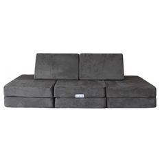 a large gray couch with four seats on the bottom and one arm folded over it