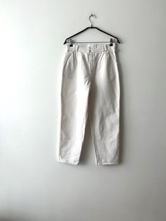 "Vintage 90s Ivory White Summer Pants High Waist Pants Banana Capri pants Boyfriend Pants Boho Comfortable Unisex festival cropped pants  Estimated size:  women's - Medium to large Mens - Small to medium Measurements:  Waist: 30.5\"/ 77.5 cm From crotch to waist line: 12.5\"/ 31.7 cm Pant leg inseam: 26.5\"/ 67 cm Length: 38\"/ 96.5 cm Please check measurements to insure a proper fit. Remember to allow yourself some extra room for movement. You can compare these with something from your closet that fits you well. This pants will come to you freshly laundered and ready to wear. Please convo me if you need additional measurements. Condition:  very good Vintage Condition SHIPPING * I ship worldwide via Priority mail (Latvijas Pasts) from Latvia (EU). * I ship from Europe, so please allow 2 to White Tapered Leg Bottoms For Spring, Spring White Tapered Leg Bottoms, Cropped Cotton Bottoms With Belt Loops, Vintage Relaxed Fit Summer Pants, Vintage Relaxed Fit Pants For Summer, Vintage White Bottoms For Summer, Straight Leg Pants For Spring Festival, White Parachute Pants With Tapered Leg, Spring Festival Straight Leg Pants