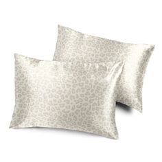 two pillows with leopard print on them, one is white and the other is beige