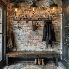 a brick wall with coat racks, lights and shoes on the floor next to it