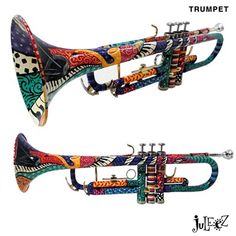 the trumpet is decorated with colorful designs on it's side and back ends,