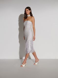 "Alana" is a strapless midi-dress designed to hug the body and accentuate the waist with an internal corset, beautifully hand-beaded with diamantés and sequins for endless sparkle. Glamorous Strapless Dress For Prom Season, Party Strapless Dress With Straight Neckline, Glamorous Strapless Dress With Fitted Bodice And Straight Neckline, Strapless Midi Dress With Fitted Bodice For Night Out, Glamorous Bandeau Formal Dress, Strapless Party Dresses With Boned Bodice, Elegant Strapless Embellished Corset Dress, Strapless Embellished Sequin Evening Dress, Glamorous Strapless Dress With Fitted Bodice For Gala