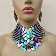 please view https://www.etsy.com/shop/Clearmilkdesign  so that you can find more Unique personalized design and follow my shop,you will see my new arrival design The closure is Lobster claw Adjustable Chain Transform your look with our Iridescent Rainbow Alloy Scalemail Choker Collar - a mesmerizing and enchanting piece that captures the whimsical allure of dragon scales. This unique choker, crafted with iridescent rainbow alloy scales, adds a touch of fantasy and magic to your ensemble. Perfect Handmade Multicolor Fantasy Jewelry, Handmade Iridescent Metal Jewelry, Unique Iridescent Jewelry For Festivals, Iridescent Fantasy Jewelry For Parties, Fantasy Iridescent Jewelry For Parties, Handmade Rave Jewelry For Party, Handmade Iridescent Fantasy Jewelry, Silver Rave Jewelry For Party, Silver Rave Jewelry For Gift