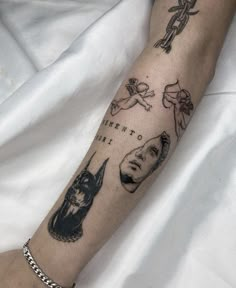 a person's arm with tattoos on it