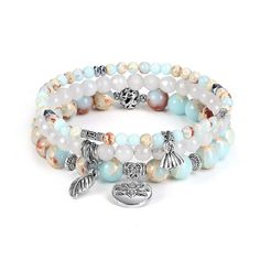 PRICES MAY VARY. Stackble Bracelest Set of 3: 6.5-7 inches round features 3 bracelets.(4mm Imperial Jasper cupule bracelet,6mm white jade leaf bracelet,8mm Imperial Jasper lotus bracelet) Facted White Jade: Jade draws off negative energy of all kinds, neutralizes background, aids concentration and unlocks memory. In Chinese culture, Lotus flower means purity and harmony. Imperial Jasper Crystal Healing Bead Bracelet: Imperial jasper is considered to be one of the five fine jaspers. This gemstone Beach Charm Bracelet, Chakra Beads Bracelet, Lotus Bracelet, Chakra Beads, Leaf Bracelet, Bracelets Set, Charm Beads, Crystal Beads Bracelet, Chakra Bracelet