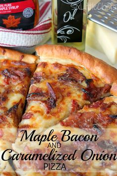 a pizza with bacon and caramelized onions on it next to a bottle of maple bacon