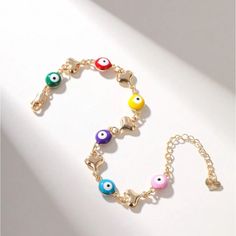 Multi Candy Colored Evil Eye Charm Bracelet Green, Red, Yellow, Purple, Blue And Pink Colored Evil Eyes With Dainty Gold Heart Charm Detailing Gold Chain So Gorgeous & Chic Most Beautiful Gift Dimensions In Last Photo New - Perfect Condition Valentine’s Day Love Gift Colorful Rainbow Multicolor Copper Trendy Gorjana White Gold Silver Metallic 14k Adinas Jewels Swarovski Eye Yellow Gold Black Pupil Diamond Accented Baublebar Mejuri 14k Link Gorjana Alex And Ani Hands Cz Shashi Mejuri Coach Mezzo Metal Bracelets With Heart Beads, Multicolor Heart-shaped Bracelets For Party, Gold Heart Evil Eye Jewelry, Valentine's Day Multicolor Heart Bracelet, Multicolor Evil Eye Bangle Bracelet Gift, Multicolor Heart-shaped Party Bracelet, Multicolor Heart-shaped Party Bracelets, Multicolor Heart Beads Charm Bracelet, Evil Eye Metal Bracelet Gift