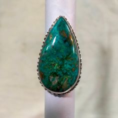 Natural Chrysocolla // Chrysocolla Silver Ring // Statement Ring // 925 Sterling Silver // Silver Ring // Shape Teardrop // Size 21x40 MM Stone Size = 21x40 MM Stone Shape = Teardrop Weight in Grams = 15.00 gm (approx) About Chrysocolla :- Due to being somewhat more common than turquoise, its wide availability, and vivid, beautiful blue and blue-green colors, chrysocolla has been popular for use as a gemstone for carvings and ornamental use since antiquity. It is often used in silversmithing and goldsmithing in place of turquoise and is relatively easy to work and shape. Chrysocolla exhibits a wide range of Mohs hardness ranging from 2 through 7, which is dependent on the amount of silica incorporated into the stone when it is forming. Generally, dark navy blue chrysocolla is too soft to b Luxury Chrysocolla Turquoise Ring, Luxury Silver Turquoise Ring With Chrysocolla, Luxury Blue Turquoise Chrysocolla Ring, Luxury Green Chrysocolla Rings, Luxury Silver Chrysocolla Rings, Copper Mineral, Friendship Symbols, Cyan Blue, Ring Shapes