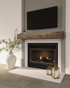 a living room with a fireplace and television mounted above the fire place in front of it