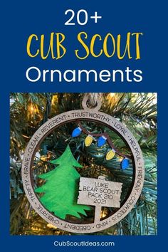 a christmas ornament hanging from a tree with the words cub scout ornaments on it