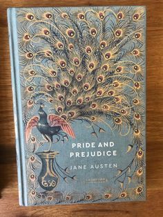 the book pride and prejudicce by jane auster on a wooden table