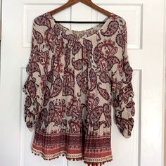 Beautiful Boho Paisley Decree Size Large Top With Scallop Sleeves And Flounce Hem. Trim Has Mini Pompoms. Very Light Fabric With Elastic Trim Along Top With Wide Scoop Neckline. Approximately 27” From Shoulder To Back Hem. Bohemian Patterned Tops With Paisley Print, Casual Boho Print Patterned Peasant Top, Paisley Print Top For Beach In Fall, Flowy Boho Print Patterned Tops, Fall Paisley Print Top For The Beach, Fall Vacation Tops With Paisley Print, Bohemian Cotton Tops With Paisley Print, Fall Vacation Top With Paisley Print, Bohemian Cotton Blouse With Paisley Print