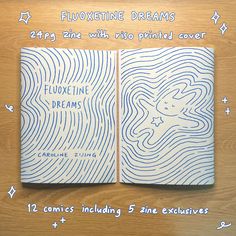 two notebooks with the words fluoxine dreams written in blue ink on them