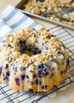 a blueberry bunt cake sitting on top of a cooling rack