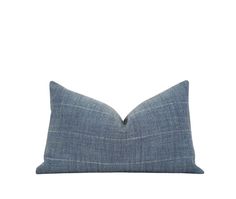 a blue pillow on a white background