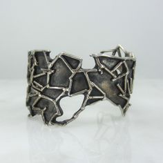 "This INCREDIBLE cuff was made in sterling silver circa 1970's in the Brutalist style and man does it look amazing on!  Gorgeous.  Fits a small to medium wrist. Not stamped or signed but tested for sterling silver. Measures 1 5/8\" at the widest.  Interior measures 2.5 x 2\".  Opening is currently 1\" but can be adjusted by a jeweler. Weighs 66 grams. In great vintage condition with excellent patina. All purchases from Bavier Brook arrive in an elegant box, fully wrapped in fine paper. Please inquire for international shipping. Don't hesitate to ask if you have any questions, we are happy to answer them!" Modern Bracelet, Modern Bracelets, Modernist Jewelry, Vintage Bracelet, Post Modern, Jewelry Inspo, Vintage Bracelets, Postmodernism, Cuff Bracelets