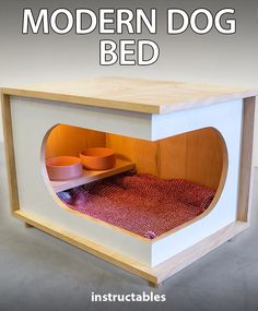 a small white and wood cabinet with two orange bowls in the center, on top of a red rug