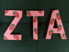 the letters are decorated with strawberries and strawberrys to spell out the word za