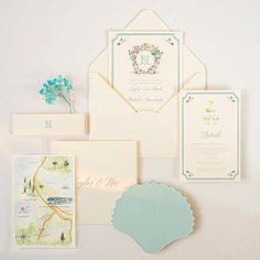 the wedding stationery is laid out neatly