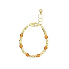 Topaz, a lavish golden brown mixed with yellow to create a honey-like hue viewed as a symbol for wisdom, sincerity and strength. Celebrate that special occasion in your life with a unique handmade birthstone bracelet. These genuine Swarovski crystals are surrounded by 3mm beads. . The perfect accessory for every little girl! Made with the highest quality materials, this bracelet will look beautiful for years to come. Durable enough for play, precious enough to keep forever. Materials: 14k gold f Spiritual Gold Bracelet With Round Beads, Adjustable Spiritual Gold Bracelet With Round Beads, Adjustable Gold Citrine Bracelet, Amber Beaded Bracelets With Polished Beads As Gift, Gold Citrine Beaded Bracelets With Round Beads, Amber Beaded Bracelets As Gift, Amber Beaded Bracelets For Gift, Gold Citrine Round Beaded Bracelets, Spiritual Gold Bracelet With Round Beads As Gift