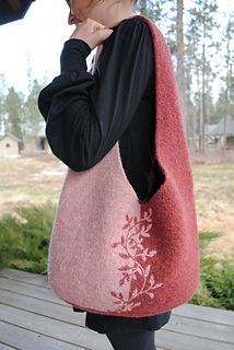 a woman carrying a pink bag on top of a wooden deck