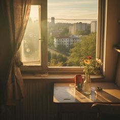 a vase with flowers sitting on top of a table next to a window sill