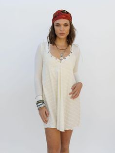 The Northern Star Mini Dress in Egret is the perfect seasonless staple. Made from light, breathable shirred striped cotton, it’s ideal for layering in fall or worn solo in warmer weather. Whether paired with boots and a jacket or styled with sandals, this dress offers endless versatility. Spring Long Sleeve Cotton Beach Dress, Bohemian Mini Dress For Beach Season Daywear, Summer Bohemian Mini Dress With Relaxed Fit, Bohemian Mini Dress With Relaxed Fit For Summer, Casual Cotton Long Sleeve Beach Dress, Off White Bohemian Mini Dress For Summer, Star Mini Dress, Chic Bathing Suits, Northern Star