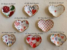 six heart shaped dishes with different designs on them