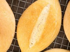 several loaves of bread on a cooling rack