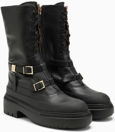 Step up your style game with these fierce black biker boots. Crafted from high-quality leather, these boots feature a tough lugged sole, giving you the perfect combination of edgy style and practicality. The decorative buckles add a touch of flair, while the inner side zip makes them easy to slip on and off. Whether you're hitting the streets or heading out for a night on the town, these boots are sure to make a bold statement. Black leather biker boot Lugged sole for added traction Decorative b Black Biker Boots, Biker Look, Leather Biker Boots, Edgy Style, Biker Boots, Lug Sole, Edgy Fashion, Designer Sunglasses, Biker Boot