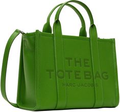 Grained leather tote in green. · Rolled carry handles · Adjustable and detachable crossbody strap · Logo embossed at face · Carry handle at side · Leather logo patch at back face · Bumper pads at base · Zip closure · Zip pocket and patch pockets at interior · Twill lining · Logo-engraved silver-tone hardware · H11 x W13 x D6 Supplier color: Kiwi The Marc Jacobs Tote Bag, Marc Jacobs Tote Bag, Medium Tote Bag, Marc Jacobs Tote, The Tote Bag, Silver Engraving, Medium Tote, Leather Logo, Crossbody Strap