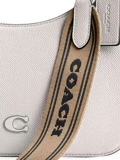 This COACH hobo bag features a detachable coated canvas shoulder strap. Detailed with contrast lining, the interior includes one card slot..Detachable shoulder strap.Top handle.Interior: one card slot.Top zip closure.Leather.Lined.Imported.SIZE.About 8.75''W x 7.25''H x 2.5''D.Top handle, about 21.75'' drop.Removable crossbody strap, about 25'' drop.This COACH hobo bag features a detachable coated canvas shoulder strap. Detailed with contrast lining, the interior includes one card slot.Detachable shoulder strapTop handleInterior: one card slotTop zip closureLeatherLinedImportedSIZEAbout 8.75''W x 7.25''H x 2.5''DTop handle, about 21.75'' dropRemovable crossbody strap, about 25'' drop Coated Canvas Shoulder Bag With Logo Strap, Everyday Top Handle Shoulder Bag With Logo Strap, Beige Shoulder Bag With Logo Strap, Daily Use Top Handle Shoulder Bag With Logo Strap, Daily Use Tote Shoulder Bag With Logo Strap, Daily Use Shoulder Bag With Logo Strap Tote, Business Bag With Logo Strap, Chic Shoulder Bag With Logo Strap For Daily Use, Chic Daily Use Shoulder Bag With Logo Strap