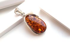 Enjoy Great Opening Prices Genuine natural amber pendant with 925 sterling silver. All of our products are created from genuine natural Baltic Amber. Perfect as a special gift for someone you care about or to wear yourself as a means of expressing your individuality and identity. Comes ready in a Gift Box. Amber is popular as it has marvelous metaphysical properties for psychic protection. It is a powerful healer that gives the person who wears it a lovely sense of health and healing. Amber help Brown Baltic Amber Jewelry With Polished Finish, Classic Baltic Amber Jewelry As Gift, Brown Baltic Amber Jewelry For Gift, Baltic Amber Necklace, Psychic Protection, Cognac Color, Amber Pendant, Natural Amber, Amber Necklace