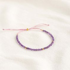 A dainty amethyst beaded bracelet with gold vermeil bead accents. This gorgeous bracelet is a perfect way to add a pop of color to your summer wardrobe.

Amethyst meaning: Amethyst stones inspire peace, intuition and clarity of thought.


Amethyst gemstones measure at 2.5mm.

Bracelet has an adjustable cord and can be worn at lengths between 5.5” to 9.5”. Lavender Bracelets With Tiny Beads For Gift, Purple Bohemian Bracelet For Everyday Wear, Purple Bohemian Bracelet For Everyday, Adjustable Purple Bracelet With Tiny Beads, Adjustable Purple Bracelets With Tiny Beads, Lavender Beaded Bracelet With Tiny Beads For Gifts, Purple Tiny Beads Beaded Bracelets As Gift, Adjustable Lavender Beaded Bracelets With Tiny Beads, Adjustable Lavender Jewelry For Everyday