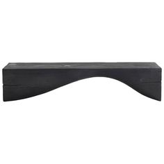 a black wooden shelf sitting on top of a white wall