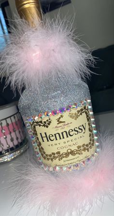 a bottle of hennesy cologne sitting on top of a table