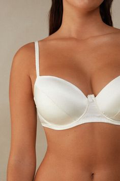 Embrace your beauty

The snug underwire and padded cups provide optimal support, while adjustable double braided straps add an elegant touch. Designed to enhance your décolleté with a sensual and refined silhouette, it's time to embrace the allure of silk and shine with confidence. Elegant Push-up Bra With Adjustable Straps, Classic Cream Bra With Padded Cups, Classic Bra With Removable Cups And Underwire, Elegant Push-up Bra With Straps, Classic Underwire Bra With Adjustable Straps, Classic Padded Push-up Bra, Feminine Cream Bra With Padded Cups, Classic Padded Bra, Elegant Bra With Removable Cups And Underwire