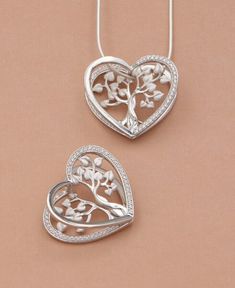 You’ll heart this Tree of Life’s pendant’s exquisite architecture. Its multiple layers create stunning depth and dimension while crystal inlays round out the design with a sparkling border. The Tree of Life represents harmony and the interconnectedness of all life. And as the heart shape reminds us, what greater connecting force is there than love? Made of sterling silver, this pendant measures 1 inch wide and 0.875 inches long. Tree of Life heart pendant Unique three-dimensional design Sterling Tree Of Life Round Pendant Jewelry For Anniversary, Elegant Tree Of Life Jewelry For Anniversary, Elegant White Gold Tree Of Life Jewelry, Elegant Tree Of Life Necklace For Anniversary, Necklace Women Gold, Women Gold Chain, Chain Locket, Basket Vintage, Gold Chain Design