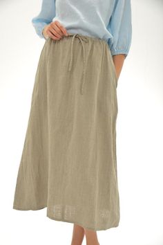 Long and wide comfortable skirt in pure linen.Waist with elastic and drawn string.At sides - two hidden big pockets.Skirt length 90cm (35.5")On 3 first pictures item in naturak undyed flax linen, on last 2 pics - silver grey color Linen fabric washed and should not shrink anymore.For this item I recommend delicate handwash machine program with gentle detergents and no bleachers, iron while damp.This item made to order average in two weeks.More color item options:www.etsy.com/listing/521030437/pu Cotton Maxi Skirt With Drawstring And Relaxed Fit, Cotton Maxi Skirt With Drawstring, Bohemian Linen Maxi Skirt For Beach, Casual Long Maxi Skirt With Drawstring, Casual Long Skirt With Drawstring, Bohemian Linen Maxi Skirt With Lined Detail, Linen Skirt For The Beach, Relaxed Linen Skirt For Beach, Linen Skirt For Beach