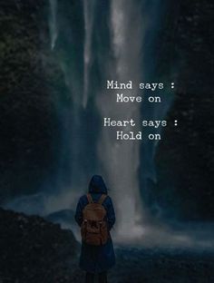 a person standing in front of a waterfall with the words, mind says move on heart says hold on