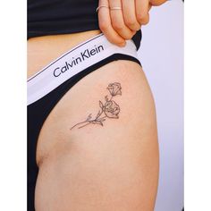 a woman's stomach with a tattoo on the side that reads, cavinklen