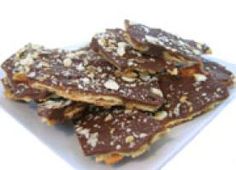 a white plate topped with chocolate and nuts