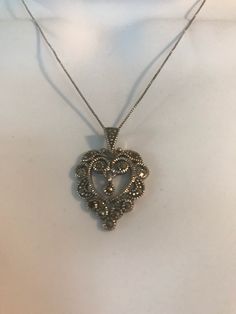 Elegant Heart Jewelry With Oxidized Finish, Elegant Heart-shaped Oxidized Jewelry, Elegant Heart-shaped Jewelry With Oxidized Finish, Victorian Silver Heart Pendant Jewelry, Antique Silver Heart Pendant Jewelry, Elegant Antique Silver Heart Pendant Jewelry, Elegant Open Heart Filigree Jewelry, Antique Silver Necklace For Valentine's Day, Elegant Antique Silver Heart Jewelry