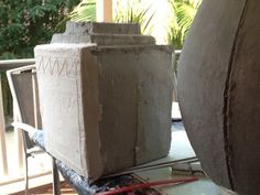 two large vases sitting on top of a table